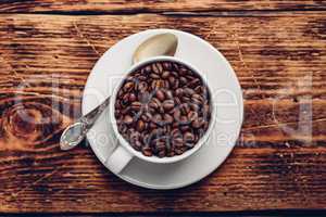 Cup full of roasted coffee beans