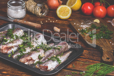 Hake carcasses on baking sheet