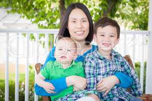 Outdoor Portrait of A Chinese Mother with Her Two Mixed Race Chi