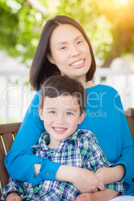 Outdoor Portrait of Chinese Mother with Her Mixed Race Chinese a