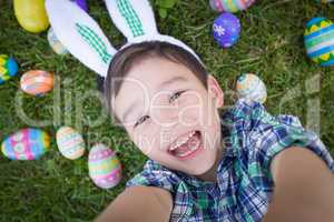 Mixed Race Chinese and Caucasian Boy Outside Wearing Rabbit Ears
