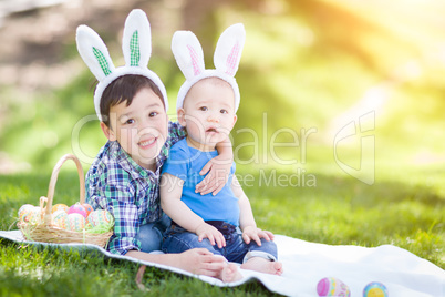 Mixed Race Chinese and Caucasian Boys Outside in Park Playing wi