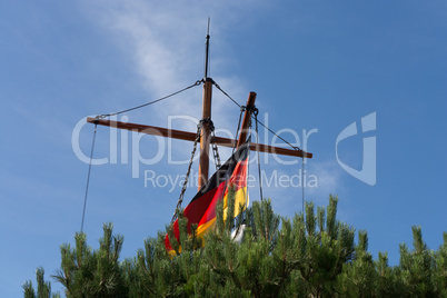 Sailing boat hidden behind reed