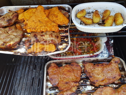 Grilled vegetables and meat on a grill