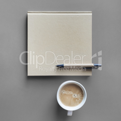 Book, pen, coffee cup