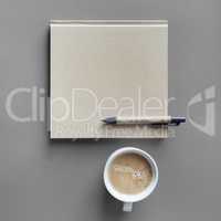 Book, pen, coffee cup