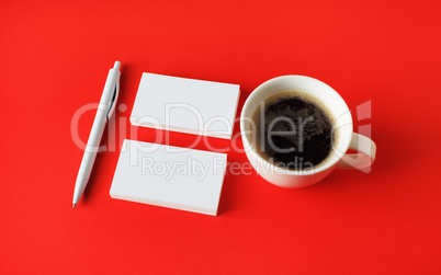 Business cards, coffee, pen