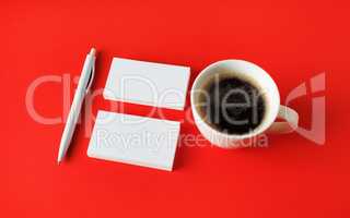 Business cards, coffee, pen