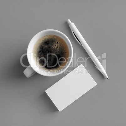 Business cards, coffee, pen