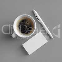 Business cards, coffee, pen