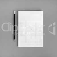 Blank copybook and pencil