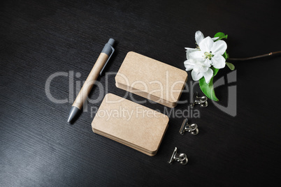 Business cards, pen, flower