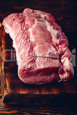 Pork loin joint on cutting board