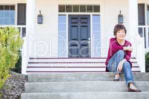 Pensive Attractive Chinese Woman On Her Front Porch