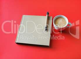 Book, coffee cup, pen