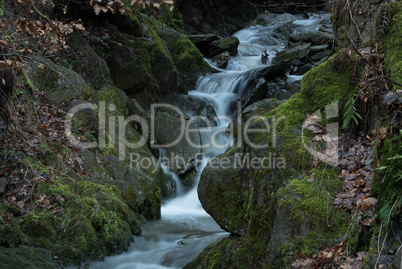 Time exposure of the little river called Helle in the german city Winterberg