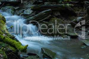 Time exposure of the little river called Helle in the german city Winterberg