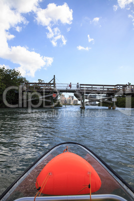 Walking bridge over Clam Pass from the view of a clear see-throu