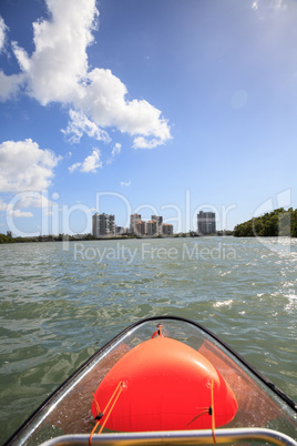 Blue skyline of buildings across from Clam Pass from the view of