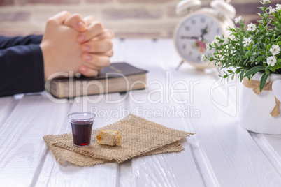 Young woman praying and Taking communion
