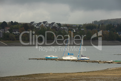 View from the german lake called Moehnesee with tiny boats