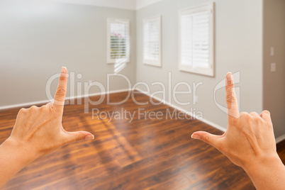 Hands Framing Empty Room of New House