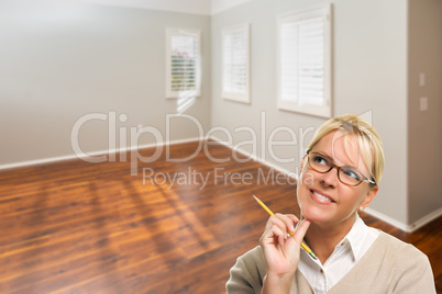 Woman With Pencil In Empty Room of New House