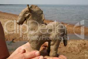 The horse is molded from fresh lake clay