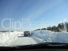 Winter road in Siberia from the car window