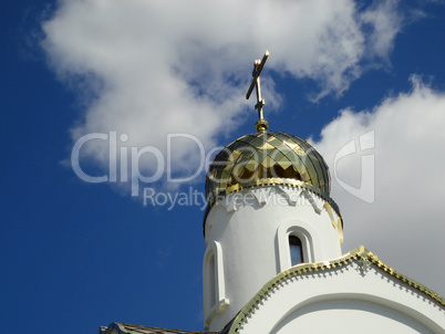 Gilded domes of Orthodox churches in Russia against the blue sky
