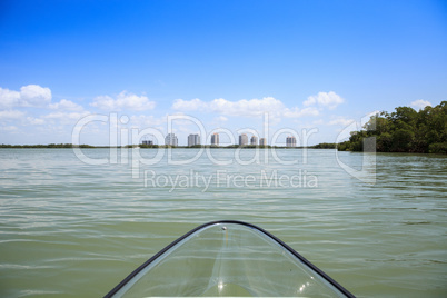 Clear kayak forges through the waterway of Lovers Key