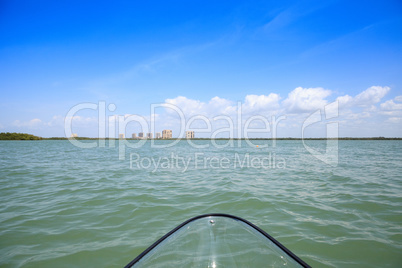 Clear kayak forges through the waterway of Lovers Key