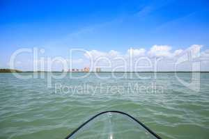 Clear kayak forges through the waterway of Lovers Key