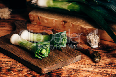 Fresh green leek on cutting board