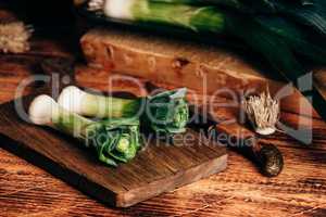 Fresh green leek on cutting board