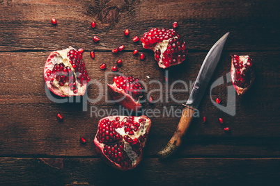 Pomegranate fruits with knife