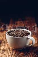 Roasted coffee beans in cup
