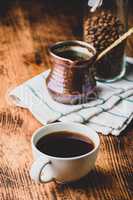 Cup of turkish coffee on wooden table