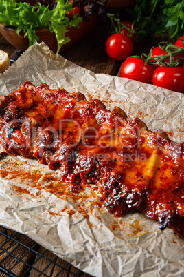 spicy spare ribs with baked potatoes and sour cream