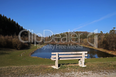 Bench on the shore of a beautiful lake