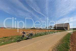 Spring landscape with an e-bike on the way