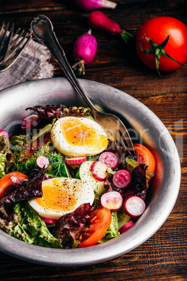 Fresh spring salad with homegrown vegetables and boiled eggs