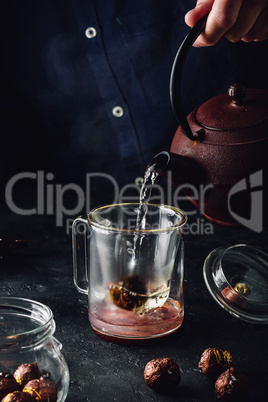 Steeping red tea in glass mug