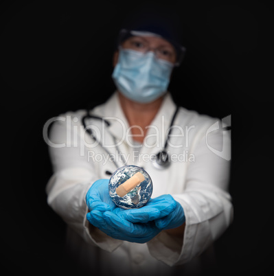 Nurse or Doctor Wearing Face Mask and Surgical Gloves Holding Ba