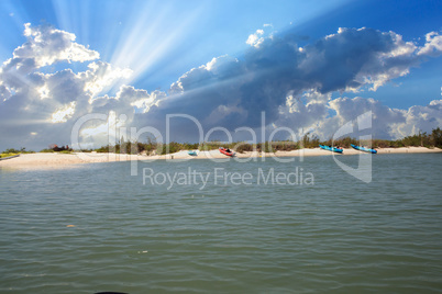 Kayaks lined up on the beach off of New Pass in Bonita Springs