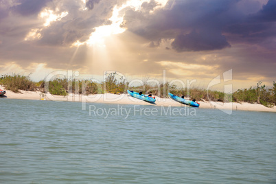 Kayaks lined up on the beach off of New Pass in Bonita Springs
