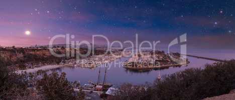 Stars and the moon above Dana Point Harbor