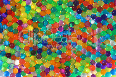 Abstract multicolored light background with hydrogel pearl texture