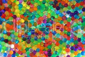 Abstract multicolored light background with hydrogel pearl texture