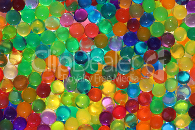 Abstract multicolored light background with hydrogel pearl texture